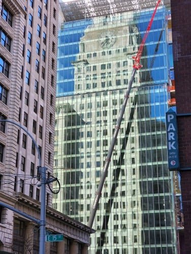 Close-up of building reflection on windows.