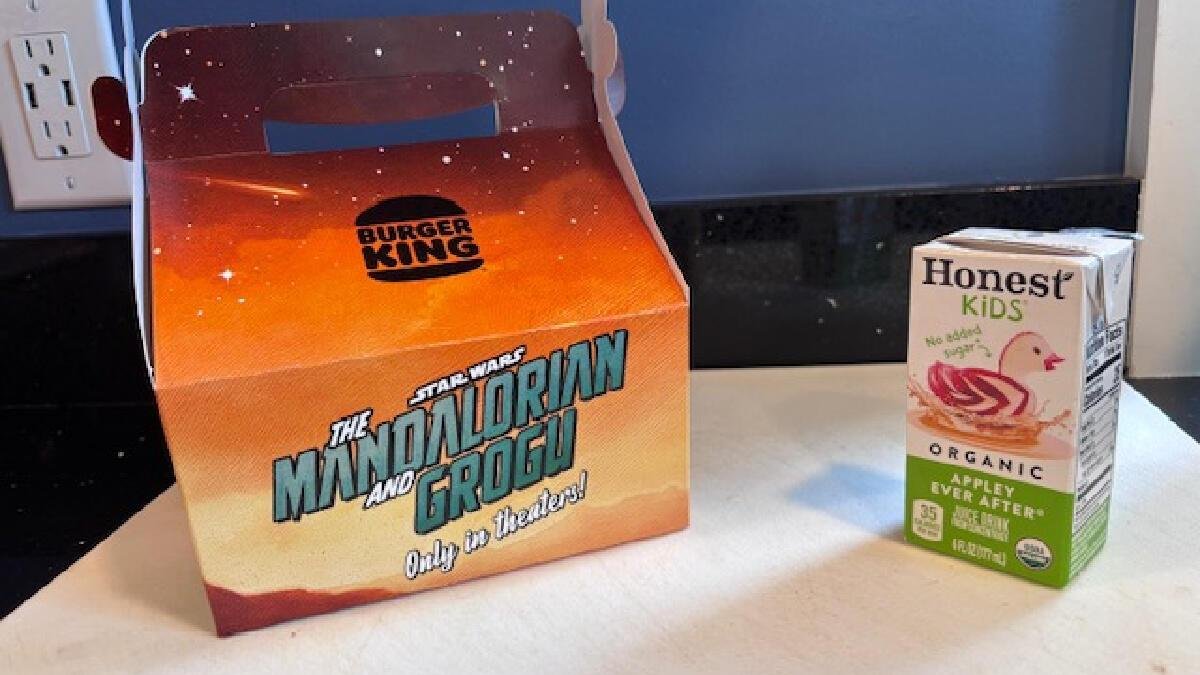 Mandalorian box and apple juice on a table
