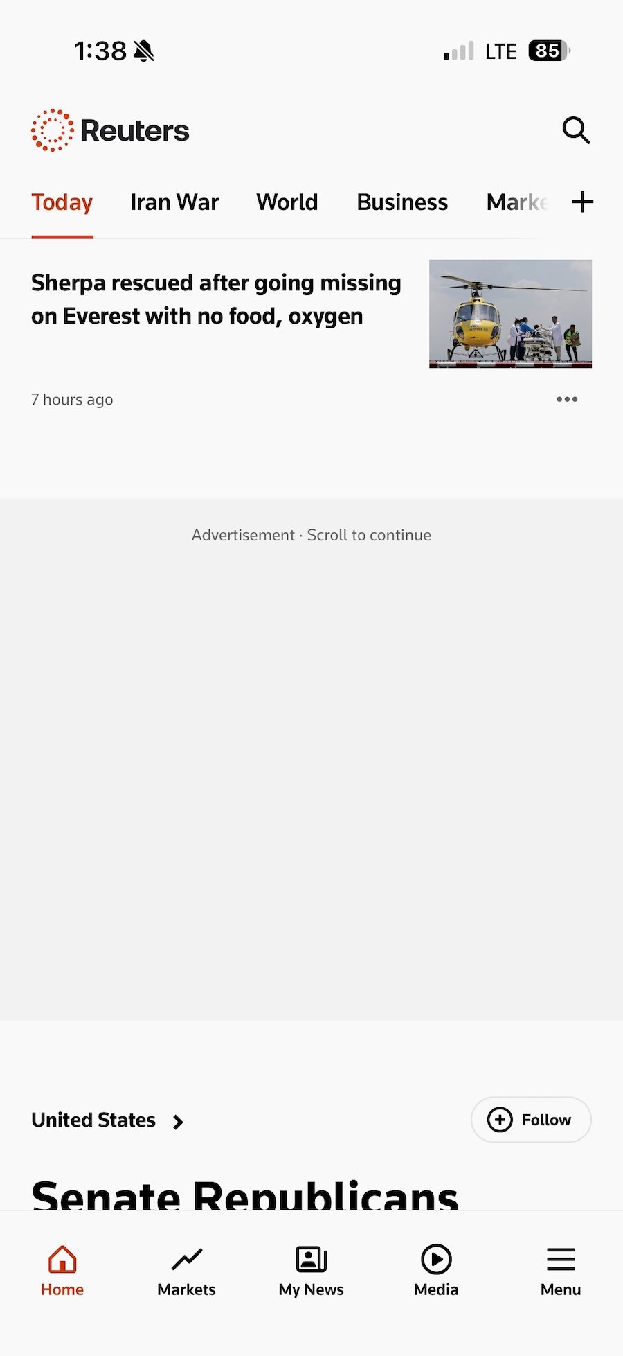a screenshot of the Reuters iOS app with ads blocked and just showing a grey rectangle with the word "Advertisement."