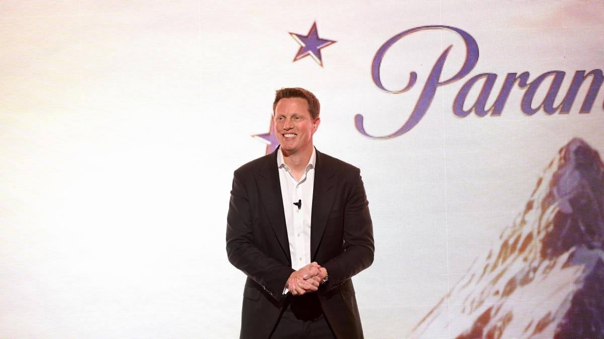 david_ellison_stands_on_stage_at_with_Paramount_logo_as_backdrop_during_2026_upfronts_event